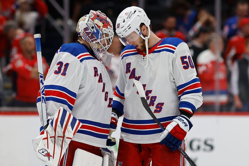 Apr 28, 2024; Washington, District of Columbia, USA; New York Rangers goaltender Igor Shesterkin (31) celebrates with Rangers left wing Will Cuylle (50) after their game against the Washington Capitals in game four of the first round of the 2024 Stanley Cup Playoffs at Capital One Arena. Mandatory Credit: Geoff Burke-USA TODAY Sports