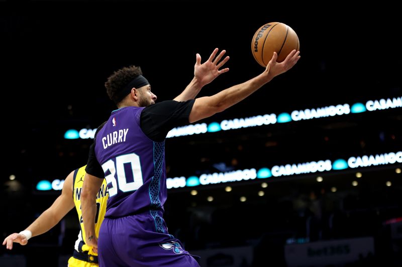 CHARLOTTE, NORTH CAROLINA - FEBRUARY 12: Seth Curry #30 of the Charlotte Hornets lays the ball up during the first half of an NBA game against the Indiana Pacers at Spectrum Center on February 12, 2024 in Charlotte, North Carolina. NOTE TO USER: User expressly acknowledges and agrees that, by downloading and or using this photograph, User is consenting to the terms and conditions of the Getty Images License Agreement. (Photo by David Jensen/Getty Images)