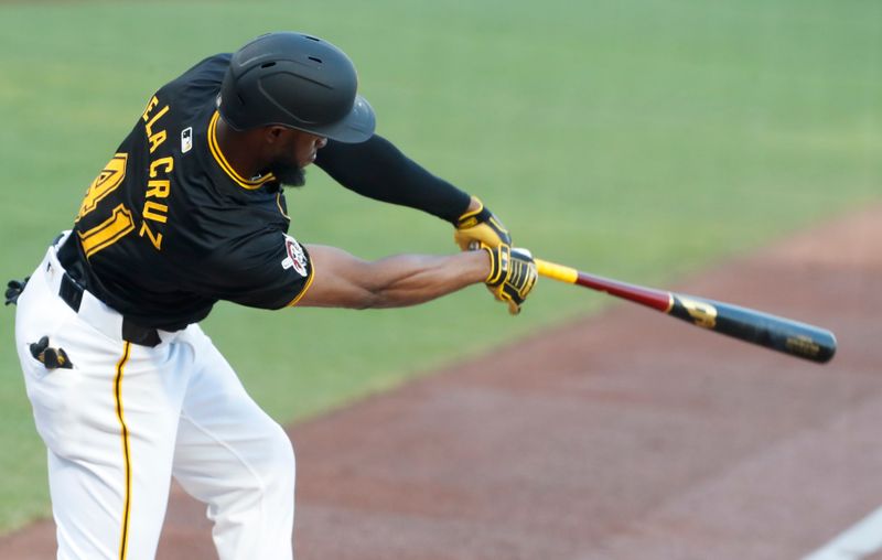 Aug 27, 2024; Pittsburgh, Pennsylvania, USA;  Pittsburgh Pirates right fielder Bryan De La Cruz (41) hits an RBI single against the Chicago Cubs during the first inning at PNC Park. Mandatory Credit: Charles LeClaire-USA TODAY Sports