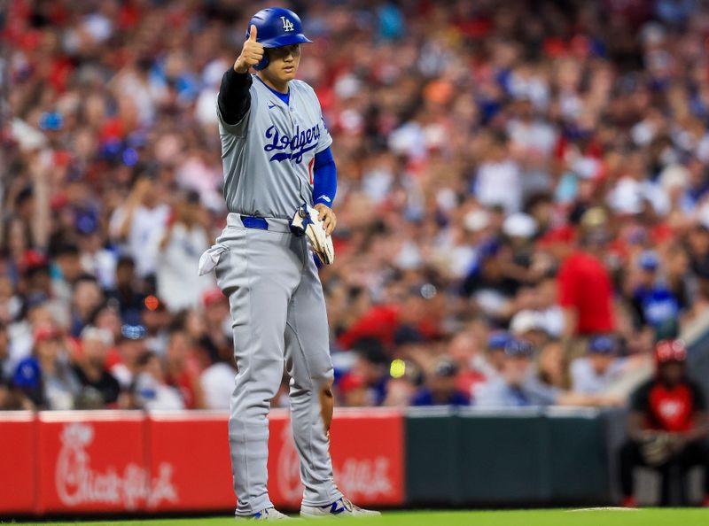 May 25, 2024; Cincinnati, Ohio, USA; Los Angeles Dodgers designated hitter Shohei Ohtani (17) reacts after a play in the sixth inning against the Cincinnati Reds at Great American Ball Park. Mandatory Credit: Katie Stratman-USA TODAY Sports