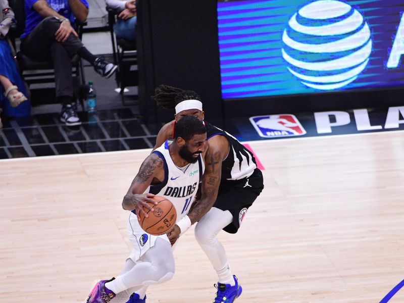 LOS ANGELES, CA - APRIL 23: Kyrie Irving #11 of the Dallas Mavericks goes to the basket during the game against the LA Clippers during Round 1 Game 2 of the 2024 NBA Playoffs on April 23, 2024 at Crypto.Com Arena in Los Angeles, California. NOTE TO USER: User expressly acknowledges and agrees that, by downloading and/or using this Photograph, user is consenting to the terms and conditions of the Getty Images License Agreement. Mandatory Copyright Notice: Copyright 2024 NBAE (Photo by Adam Pantozzi/NBAE via Getty Images)