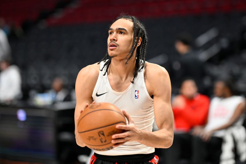 PORTLAND, OREGON - FEBRUARY 15: Dalano Banton #5 of the Portland Trail Blazers warms up before the game against the Minnesota Timberwolves at the Moda Center on February 15, 2024 in Portland, Oregon. NOTE TO USER: User expressly acknowledges and agrees that, by downloading and or using this photograph, User is consenting to the terms and conditions of the Getty Images License Agreement. (Photo by Alika Jenner/Getty Images)