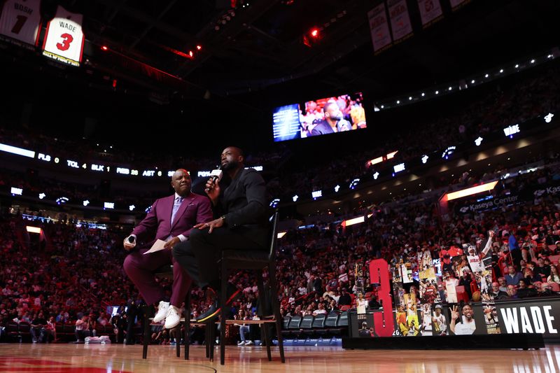 MIAMI, FLORIDA - JANUARY 14: Former Miami Heat player Dwayne Wade addresses the crowd during a Hall of Fame induction ceremony during halftime of a game between the Charlotte Hornets and Miami Heat at Kaseya Center on January 14, 2024 in Miami, Florida. NOTE TO USER: User expressly acknowledges and agrees that, by downloading and or using this photograph, User is consenting to the terms and conditions of the Getty Images License Agreement.  (Photo by Megan Briggs/Getty Images)