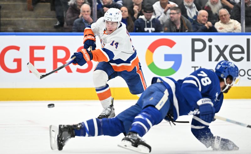 Feb 5, 2024; Toronto, Ontario, CAN;  New York Islanders forward Bo Horvat (14) shoots the puck past Toronto Maple Leafs defenseman TJ Brodie (78) in the second period at Scotiabank Arena. Mandatory Credit: Dan Hamilton-USA TODAY Sports