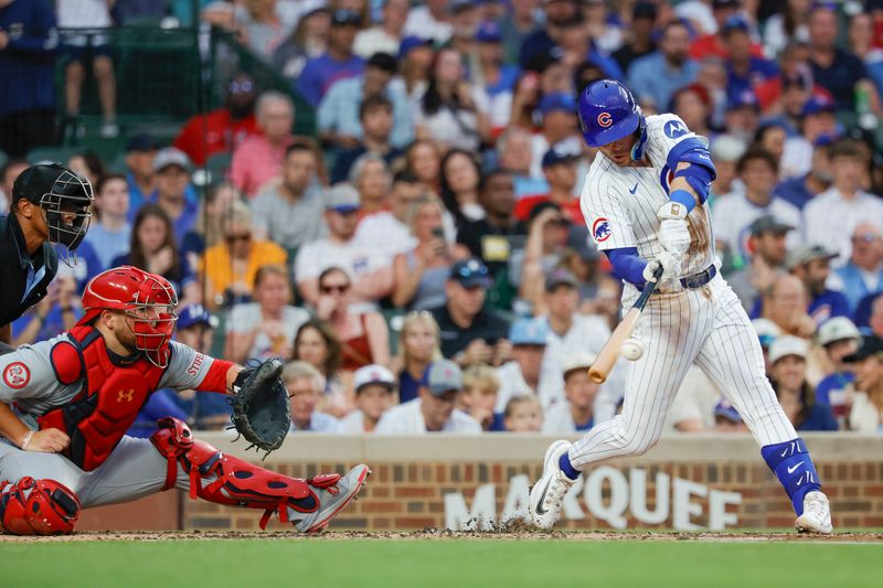 Aug 1, 2024; Chicago, Illinois, USA; Chicago Cubs second baseman Nico Hoerner (2) singles against the St. Louis Cardinals during the second inning at Wrigley Field. Mandatory Credit: Kamil Krzaczynski-USA TODAY Sports