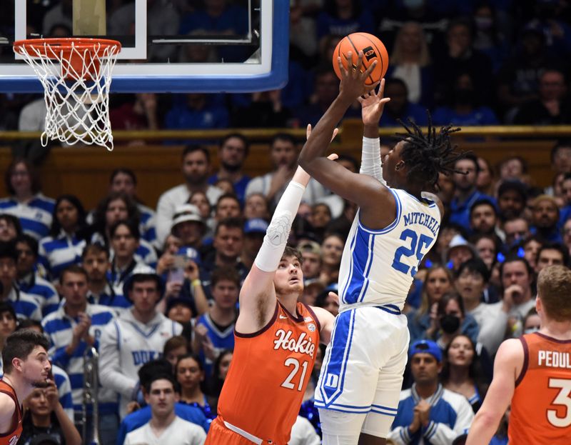 Feb 25, 2023; Durham, North Carolina, USA; Duke Blue Devils forward Mark Mitchell (25) shoots over Virginia Tech Hokies forward Grant Basile (21) during the first half at Cameron Indoor Stadium. Mandatory Credit: Rob Kinnan-USA TODAY Sports