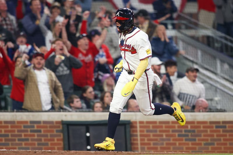 Apr 6, 2024; Atlanta, Georgia, USA; Atlanta Braves right fielder Ronald Acuna Jr. (13) scores a run against the Arizona Diamondbacks in the eighth inning at Truist Park. Mandatory Credit: Brett Davis-USA TODAY Sports