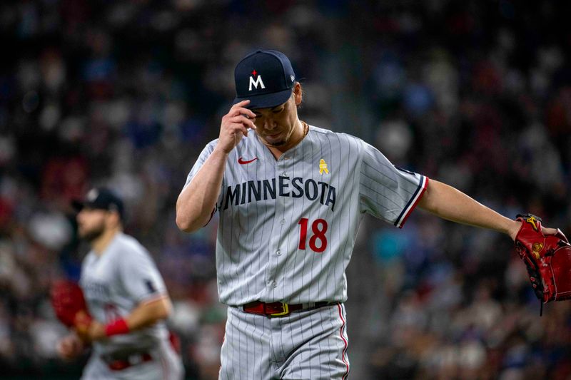 Sep 3, 2023; Arlington, Texas, USA; Minnesota Twins starting pitcher Kenta Maeda (18) walks off the field after pitching against the Texas Rangers during the fourth inning at Globe Life Field. Mandatory Credit: Jerome Miron-USA TODAY Sports