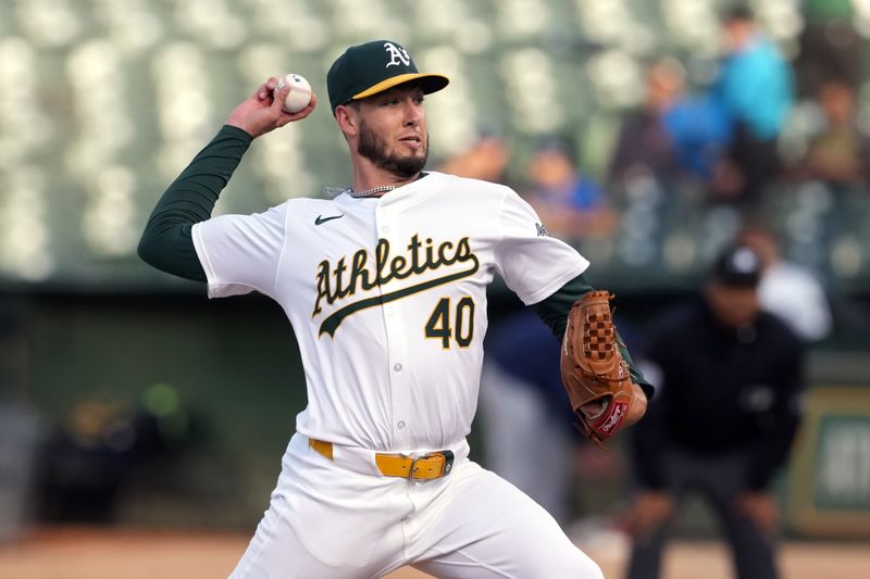 Aug 21, 2024; Oakland, California, USA; Oakland Athletics starting pitcher Mitch Spence (40) throws a pitch against the Tampa Bay Rays during the first inning at Oakland-Alameda County Coliseum. Mandatory Credit: Darren Yamashita-USA TODAY Sports