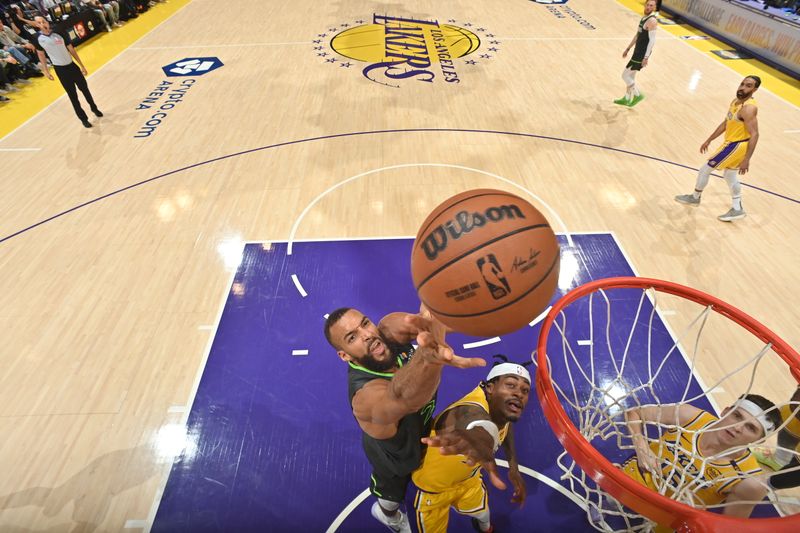 LOS ANGELES, CA - APRIL 30: Rudy Gobert #27 of the Minnesota Timberwolves drives to the basket during the game against the Los Angeles Lakers during Round One Game Five of the 2025 NBA Playoffs on April 30, 2025 at Crypto.Com Arena in Los Angeles, California. NOTE TO USER: User expressly acknowledges and agrees that, by downloading and/or using this Photograph, user is consenting to the terms and conditions of the Getty Images License Agreement. Mandatory Copyright Notice: Copyright 2025 NBAE (Photo by Adam Pantozzi/NBAE via Getty Images)