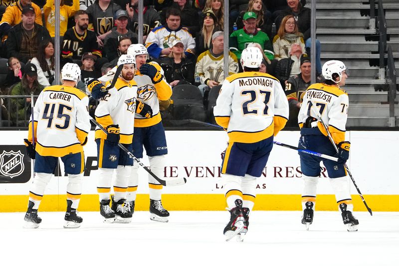 Feb 20, 2024; Las Vegas, Nevada, USA; Nashville Predators center Tommy Novak (82) celebrates with team mates after scoring a goal against the Vegas Golden Knights during the second period at T-Mobile Arena. Mandatory Credit: Stephen R. Sylvanie-USA TODAY Sports