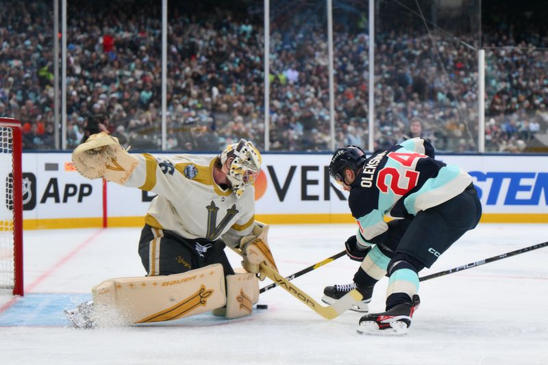 Jan 1, 2024; Seattle, Washington, USA; Vegas Golden Knights goaltender Logan Thompson (36) blocks a shot by Seattle Kraken defenseman Jamie Oleksiak (24) during the second period in the 2024 Winter Classic ice hockey game at T-Mobile Park. Mandatory Credit: Steven Bisig-USA TODAY Sports