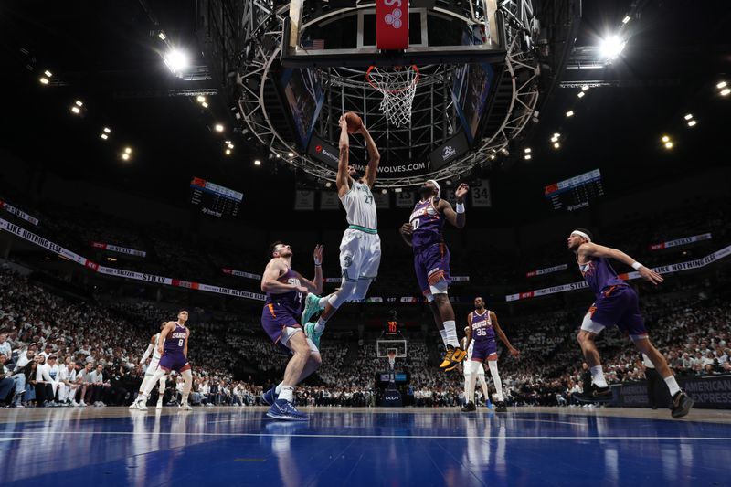 MINNEAPOLIS, MN -  APRIL 23: Rudy Gobert #27 of the Minnesota Timberwolves dunks the ball during the game against the Phoenix Suns during Round One Game Two of the 2024 NBA Playoffs on April 23, 2024 at Target Center in Minneapolis, Minnesota. NOTE TO USER: User expressly acknowledges and agrees that, by downloading and or using this Photograph, user is consenting to the terms and conditions of the Getty Images License Agreement. Mandatory Copyright Notice: Copyright 2024 NBAE (Photo by Jordan Johnson/NBAE via Getty Images)