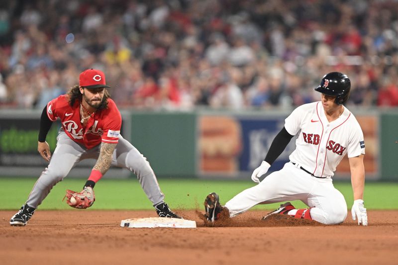 May 31, 2023; Boston, Massachusetts, USA; Boston Red Sox left fielder Rob Refsnyder (30) slides safely into second base ahead of a tag by Cincinnati Reds second baseman Jonathan India (6) during the sixth inning at Fenway Park. Mandatory Credit: Brian Fluharty-USA TODAY Sports