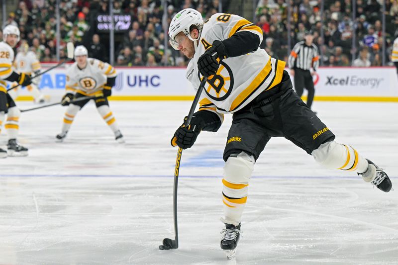 Dec 14, 2025; Saint Paul, Minnesota, USA;  Boston Bruins forward David Pastrnak (88) shoots the puck against the Minnesota Wild during the third period at Grand Casino Arena. Mandatory Credit: Nick Wosika-Imagn Images