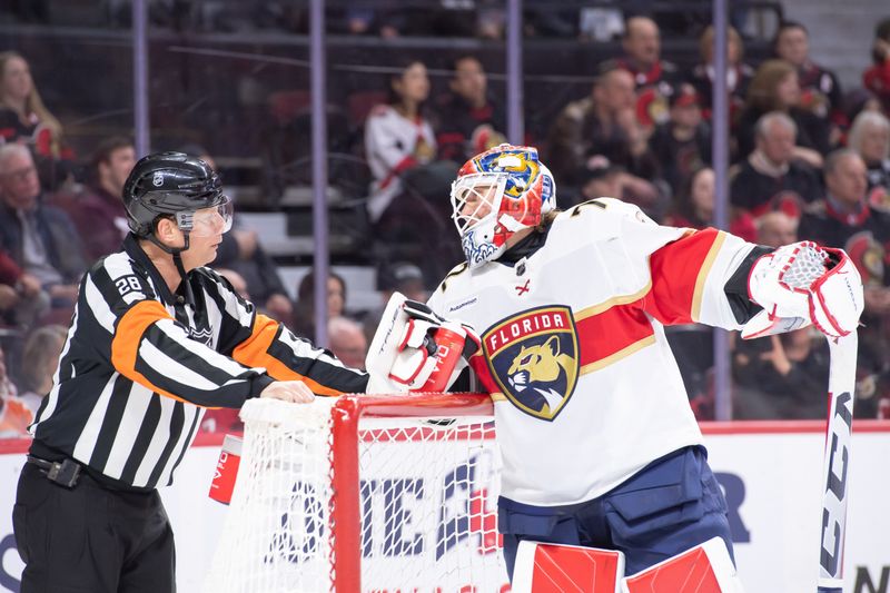 Apr 4, 2024; Ottawa, Ontario, CAN;Referee Chris Lee (28) has a word with Florida Panthers goalie Sergei Bobrovsky (72) during a break in action in the first period against the  Ottawa Senators at the Canadian Tire Centre. Mandatory Credit: Marc DesRosiers-USA TODAY Sports