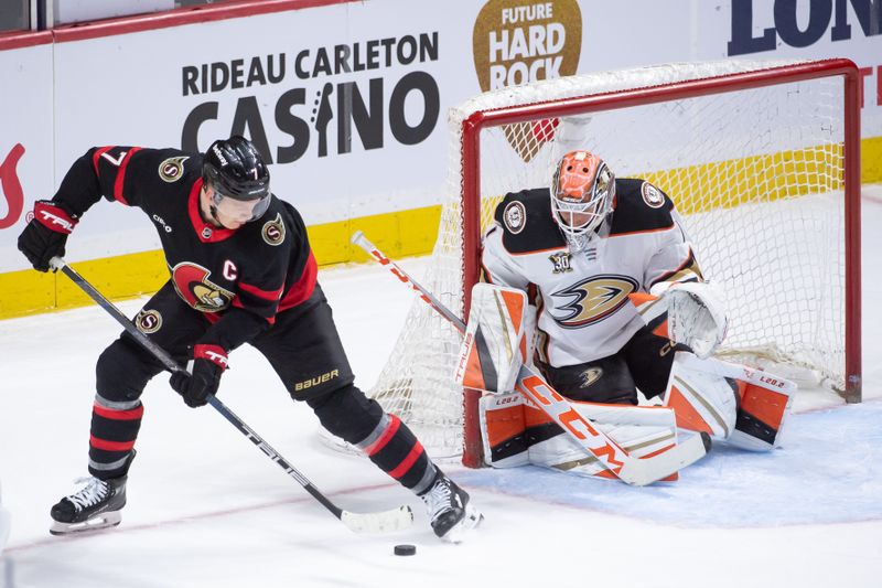 Feb 15, 2024; Ottawa, Ontario, CAN; Ottawa Senators left wing Brady Tkachuk (7) moves the puck in front of Anaheim Ducks goalie Lukas Dostal (1) in the third period at the Canadian Tire Centre. Mandatory Credit: Marc DesRosiers-USA TODAY Sports
