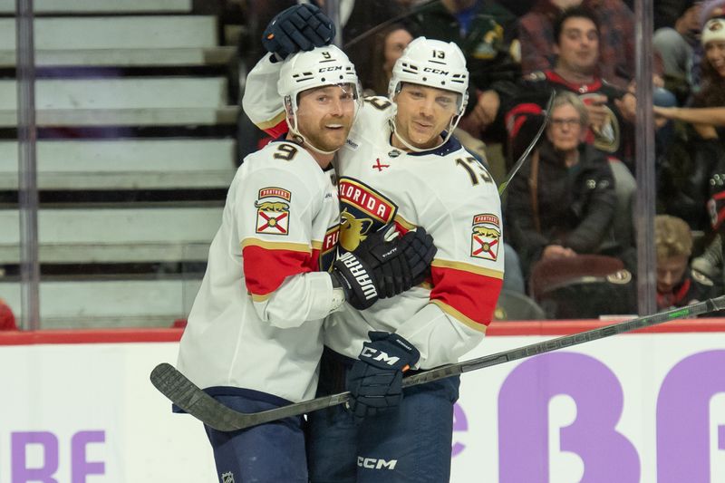 Nov 27, 2023; Ottawa, Ontario, CAN; Florida Panthers center Sam Bennett (9) celebrates with center Sam Reinhart (13) his goal scored in the second period against the Ottawa Senators at the Canadian Tire Centre. Mandatory Credit: Marc DesRosiers-USA TODAY Sports