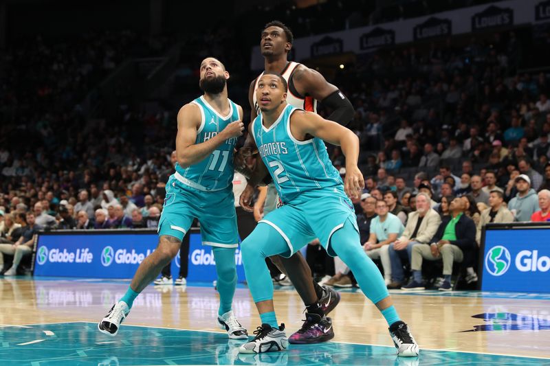 CHARLOTTE, NC -NOVEMBER 21:  Grant Williams #2 of the Charlotte Hornets and Cody Martin #11 of the Charlotte Hornets box out during the game against the Detroit Pistons on November 21, 2024 at Spectrum Center in Charlotte, North Carolina. NOTE TO USER: User expressly acknowledges and agrees that, by downloading and or using this photograph, User is consenting to the terms and conditions of the Getty Images License Agreement. Mandatory Copyright Notice: Copyright 2024 NBAE (Photo by Brock Williams-Smith/NBAE via Getty Images)