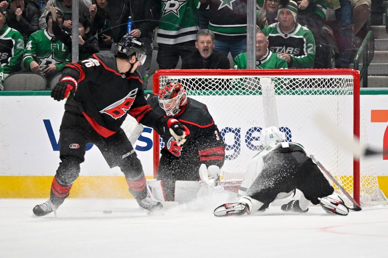 Jan 25, 2023; Dallas, Texas, USA; Dallas Stars center Ty Dellandrea (10) is tripped up on a breakaway shot against Carolina Hurricanes goaltender Frederik Andersen (31) during the first period at the American Airlines Center. Mandatory Credit: Jerome Miron-USA TODAY Sports