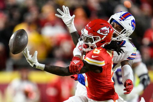 Kansas City Chiefs wide receiver Hollywood Brown (5) works for a catch against Buffalo Bills cornerback Christian Benford (47) during the first half of the AFC Championship NFL football game, Sunday, Jan. 26, 2025, in Kansas City, Mo. (AP Photo/Reed Hoffmann)