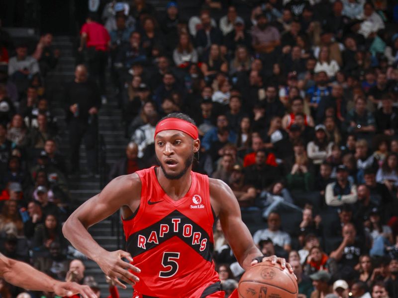BROOKLYN, NY - OCTOBER 18: Immanuel Quickley #5 of the Toronto Raptors drives to the basket during the game on October 18, 2024 at Barclays Center in Brooklyn, New York. NOTE TO USER: User expressly acknowledges and agrees that, by downloading and or using this Photograph, user is consenting to the terms and conditions of the Getty Images License Agreement. Mandatory Copyright Notice: Copyright 2024 NBAE (Photo by Nathaniel S. Butler/NBAE via Getty Images)