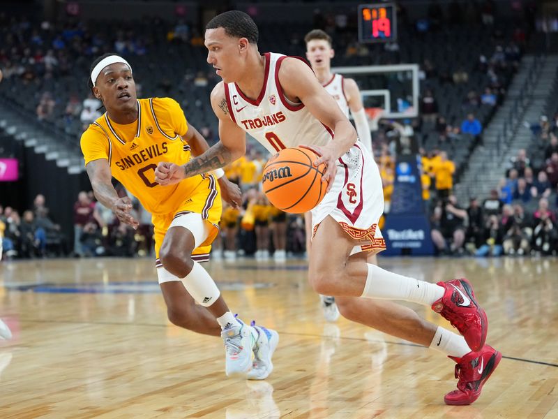 Mar 9, 2023; Las Vegas, NV, USA; USC Trojans forward Kobe Johnson (0) dribbles against Arizona State Sun Devils guard DJ Horne (0) during the second half at T-Mobile Arena. Mandatory Credit: Stephen R. Sylvanie-USA TODAY Sports