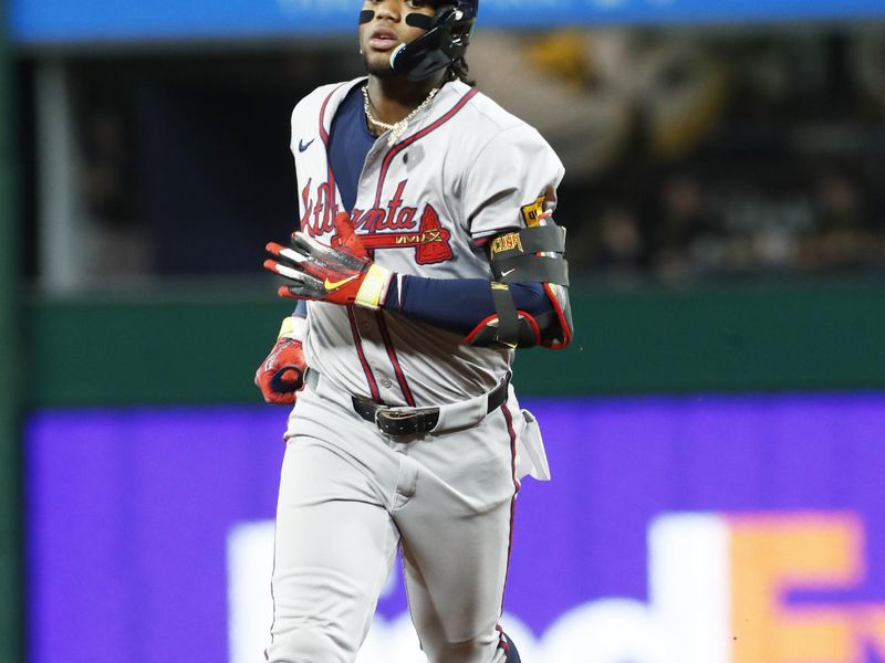 May 24, 2024; Pittsburgh, Pennsylvania, USA;  Atlanta Braves right fielder Ronald Acuna Jr. (13) circles the bases on a three-run home run against the Pittsburgh Pirates during the eighth inning at PNC Park. Mandatory Credit: Charles LeClaire-USA TODAY Sports