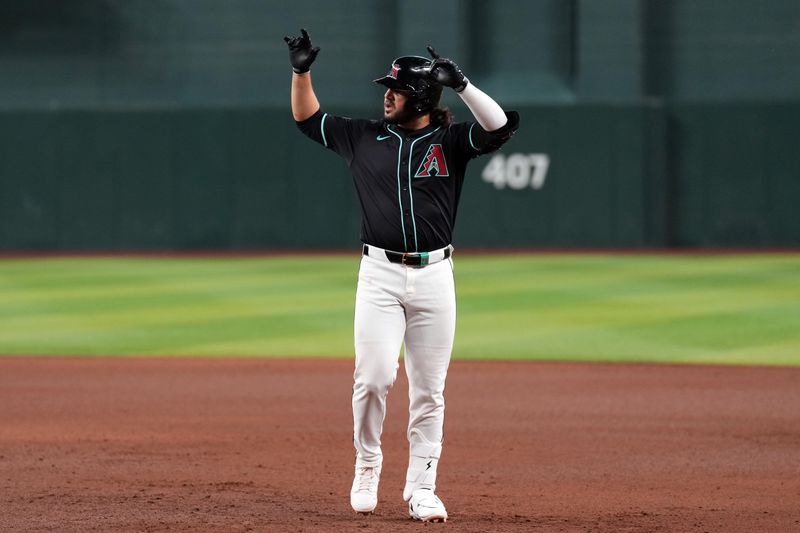 May 13, 2024; Phoenix, Arizona, USA; Arizona Diamondbacks third base Eugenio Suárez (28) reacts after hitting an RBI single against the Cincinnati Reds during the seventh inning at Chase Field. Mandatory Credit: Joe Camporeale-USA TODAY Sports