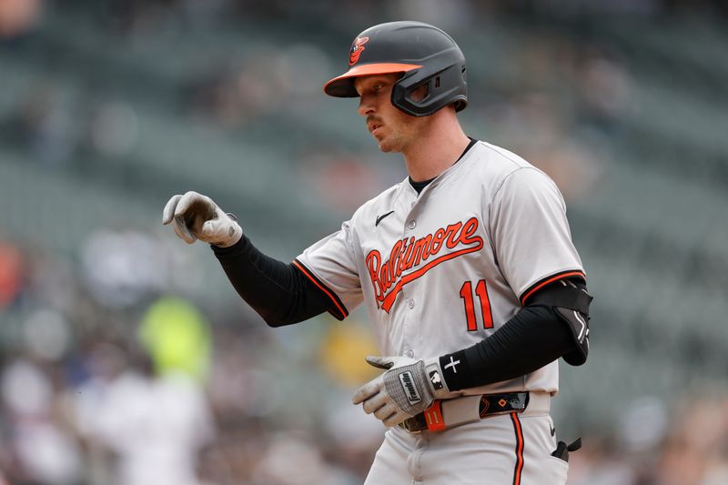 May 26, 2024; Chicago, Illinois, USA; Baltimore Orioles third baseman Jordan Westburg (11) celebrates after hitting a single against the Chicago White Sox during the sixth inning at Guaranteed Rate Field. Mandatory Credit: Kamil Krzaczynski-USA TODAY Sports