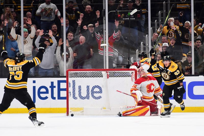 Nov 7, 2024; Boston, Massachusetts, USA;  Boston Bruins left wing Brad Marchand (63) reacts after scoring the winning goal past Calgary Flames goaltender Dustin Wolf (32) in overtime at TD Garden. Mandatory Credit: Bob DeChiara-Imagn Images