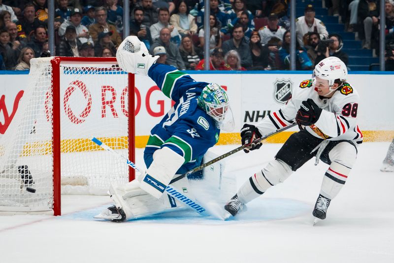 Nov 5, 2025; Vancouver, British Columbia, CAN; Chicago Blackhawks forward Connor Bedard (98) shoots wide on Vancouver Canucks goalie Kevin Lankinen (32) in the first period at Rogers Arena. Mandatory Credit: Bob Frid-Imagn Images