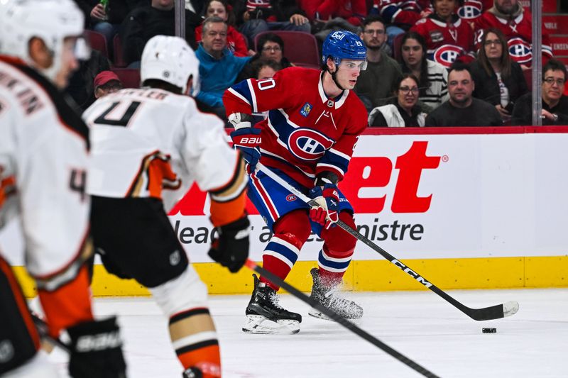 Feb 13, 2024; Montreal, Quebec, CAN; Montreal Canadiens left wing Juraj Slafkovsky (20) plays the puck against the Anaheim Ducks during the second period at Bell Centre. Mandatory Credit: David Kirouac-USA TODAY Sports