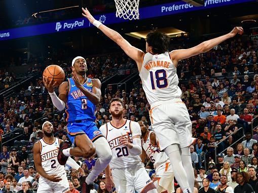 PHOENIX, AZ - NOVEMBER  12:  Shai Gilgeous-Alexander #2 of the Oklahoma City Thunder drives to the basket during the game against the Phoenix Suns on November 12, 2023 at Footprint Center in Phoenix, Arizona. NOTE TO USER: User expressly acknowledges and agrees that, by downloading and or using this photograph, user is consenting to the terms and conditions of the Getty Images License Agreement. Mandatory Copyright Notice: Copyright 2023 NBAE (Photo by Kate Frese/NBAE via Getty Images)