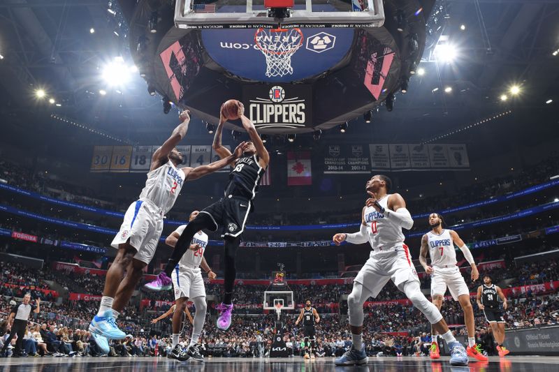 LOS ANGELES, CA - JANUARY 21: Nicolas Claxton #33 of the Brooklyn Nets rebounds during the game against the LA Clippers on January 21, 2024 at Crypto.Com Arena in Los Angeles, California. NOTE TO USER: User expressly acknowledges and agrees that, by downloading and/or using this Photograph, user is consenting to the terms and conditions of the Getty Images License Agreement. Mandatory Copyright Notice: Copyright 2024 NBAE (Photo by Adam Pantozzi/NBAE via Getty Images)