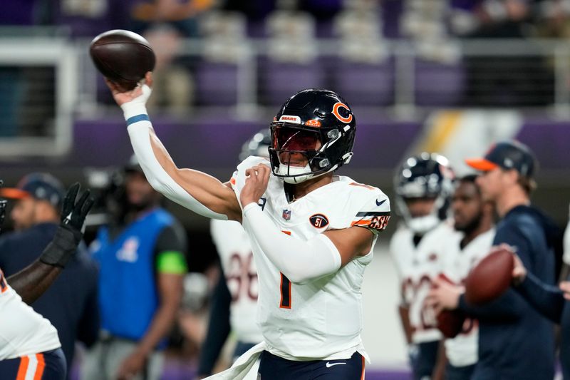 Chicago Bears quarterback Justin Fields (1) warms up before an NFL football game against the Minnesota Vikings, Monday, Nov. 27, 2023, in Minneapolis. (AP Photo/Abbie Parr)