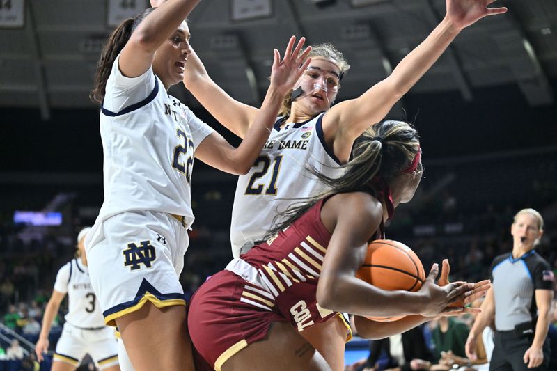 Jan 11, 2024; South Bend, Indiana, USA; Boston College Eagles guard Dontavia Waggoner (24) attempts to call a timeout as Notre Dame Fighting Irish forward Kylee Watson (22) and forward Maddy Westbeld (21) defend in the first half at the Purcell Pavilion. Mandatory Credit: Matt Cashore-USA TODAY Sports