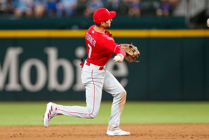 Apr 2, 2023; Arlington, Texas, USA; Philadelphia Phillies shortstop Trea Turner (7) throws over to first during the second inning against the Texas Rangers at Globe Life Field. Mandatory Credit: Andrew Dieb-USA TODAY Sports