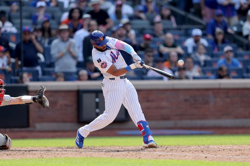 Apr 23, 2025; New York City, New York, USA; New York Mets designated hitter Starling Marte (6) hits a walkoff RBI single against the Philadelphia Phillies during the tenth inning at Citi Field. Mandatory Credit: Brad Penner-Imagn Images