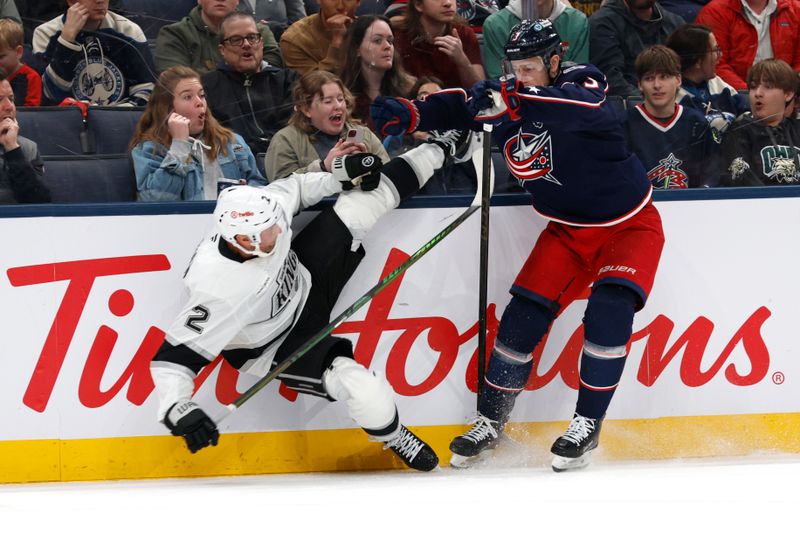 Mar 9, 2026; Columbus, Ohio, USA; Columbus Blue Jackets center Charlie Coyle (3) checks Los Angeles Kings defenseman Brian Dumoulin (2) during the second period at Nationwide Arena. Mandatory Credit: Russell LaBounty-Imagn Images