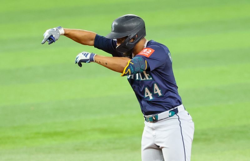 Jun 27, 2025; Arlington, Texas, USA;  Seattle Mariners center fielder Julio Rodriguez (44) reacts after hitting a double during the third inning against the Texas Rangers at Globe Life Field. Mandatory Credit: Kevin Jairaj-Imagn Images