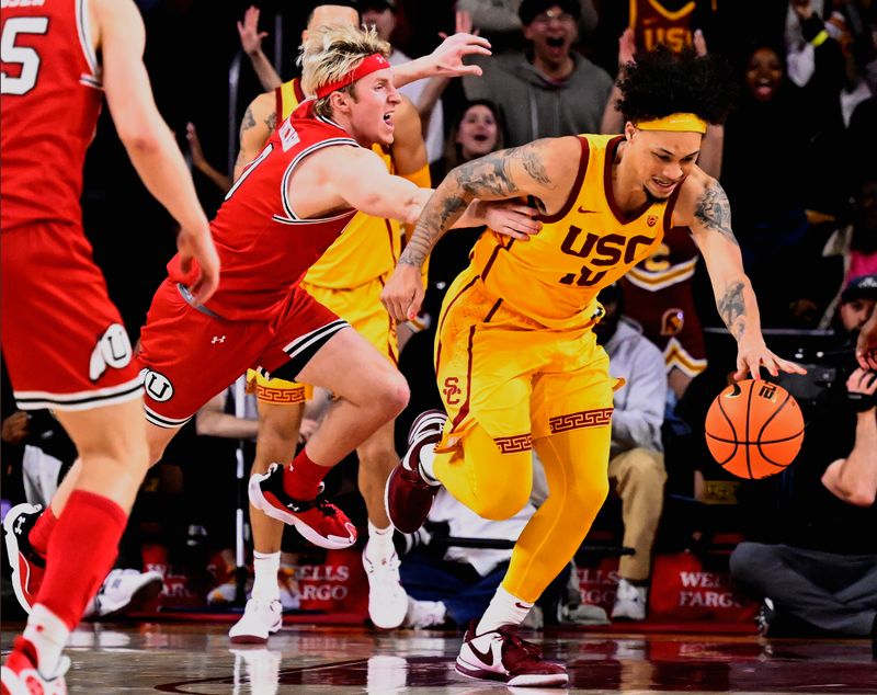 Feb 15, 2024; Los Angeles, California, USA; Southern California Trojans forward DJ Rodman (10) dribbles past Utah Utes guard Hunter Erickson (0) during the second half of an NCAA basketball game at Galen Center. Mandatory Credit: Alex Gallardo-USA TODAY Sports