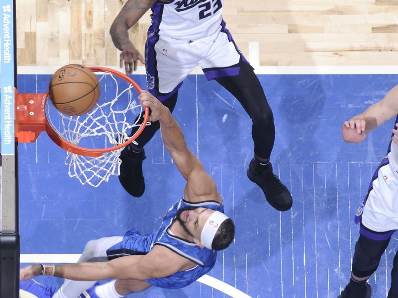 ORLANDO, FL - MARCH 23: Jalen Suggs #4 of the Orlando Magic dunks the ball during the game against the Sacramento Kings on March 23, 2024 at the Kia Center in Orlando, Florida. NOTE TO USER: User expressly acknowledges and agrees that, by downloading and or using this photograph, User is consenting to the terms and conditions of the Getty Images License Agreement. Mandatory Copyright Notice: Copyright 2024 NBAE (Photo by Fernando Medina/NBAE via Getty Images)