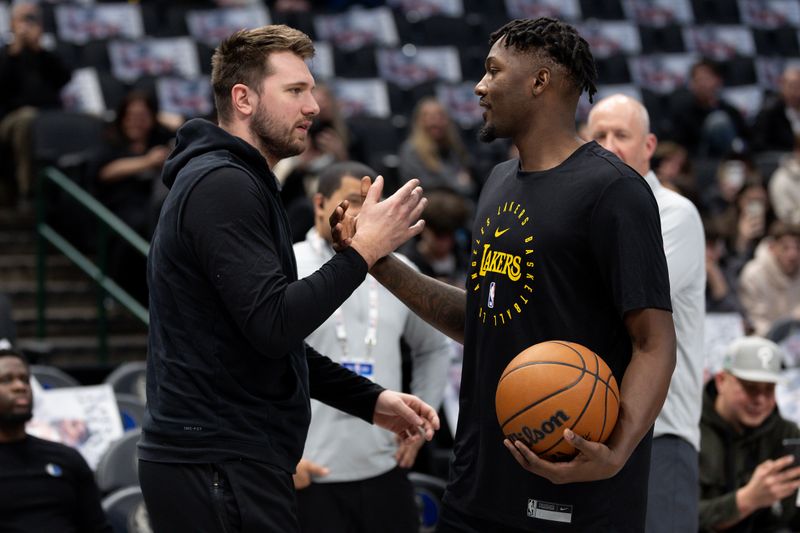 DALLAS, TEXAS - JANUARY 07: Luka Doncic #77 of the Dallas Mavericks and Dorian Finney-Smith #17 of the Los Angeles Lakers embrace before the game at American Airlines Center on January 07, 2025 in Dallas, Texas. NOTE TO USER: User expressly acknowledges and agrees that, by downloading and/or using this photograph, user is consenting to the terms and conditions of the Getty Images License Agreement. (Photo by Sam Hodde/Getty Images)