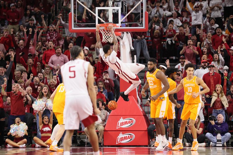 Jan 3, 2026; Fayetteville, Arkansas, USA; Arkansas Razorbacks forward Trevon Brazile (7) dunks the ball in the first half against the Tennessee Volunteers at Bud Walton Arena. Mandatory Credit: Nelson Chenault-Imagn Images