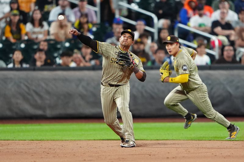 Jun 14, 2024; New York City, New York, USA; San Diego Padres third baseman Donovan Solano (39) throws out New York Mets center fielder Tyrone Taylor (not pictured) after fielding a ground ball during the second inning at Citi Field. Mandatory Credit: Gregory Fisher-USA TODAY Sports