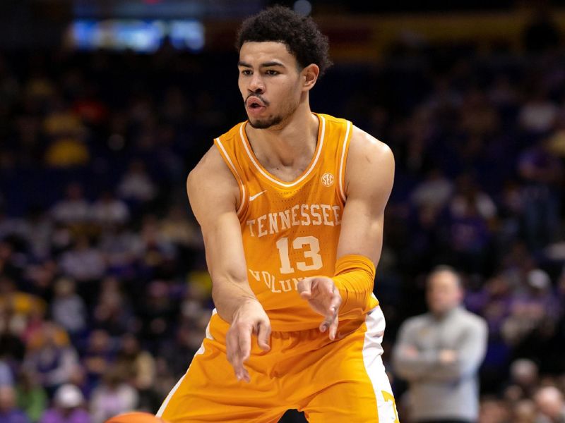 Jan 21, 2023; Baton Rouge, Louisiana, USA;  Tennessee Volunteers forward Olivier Nkamhoua (13) passes the ball against the LSU Tigers during the second half at Pete Maravich Assembly Center. Mandatory Credit: Stephen Lew-USA TODAY Sports