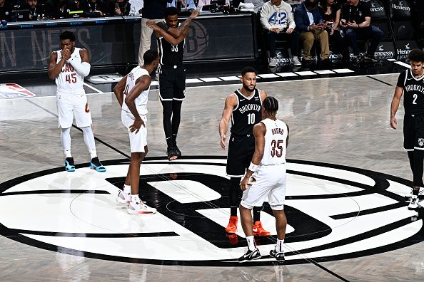 BROOKLYN, NY - OCTOBER 25: Ben Simmons #10 of the Brooklyn Nets high fives Isaac Okoro #35 of the Cleveland Cavaliers during the game on October 25, 2023 at Barclays Center in Brooklyn, New York. NOTE TO USER: User expressly acknowledges and agrees that, by downloading and or using this Photograph, user is consenting to the terms and conditions of the Getty Images License Agreement. Mandatory Copyright Notice: Copyright 2023 NBAE (Photo by David Dow/NBAE via Getty Images)