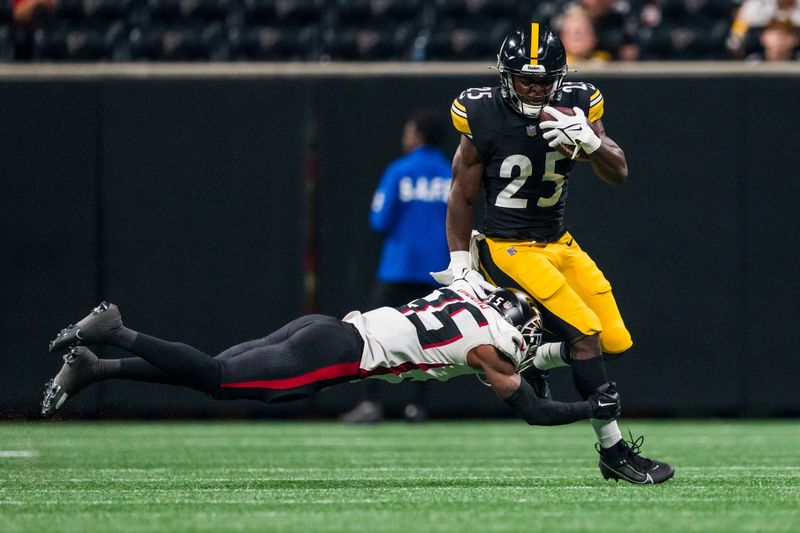 Pittsburgh Steelers running back Darius Hagans (25) runs the ball as Atlanta Falcons cornerback Natrone Brooks (35) defendsduring the second half of an NFL preseason football game, Thursday, Aug. 24, 2023, in Atlanta. The Pittsburgh Steelers won 24-0. (AP Photo/Danny Karnik)