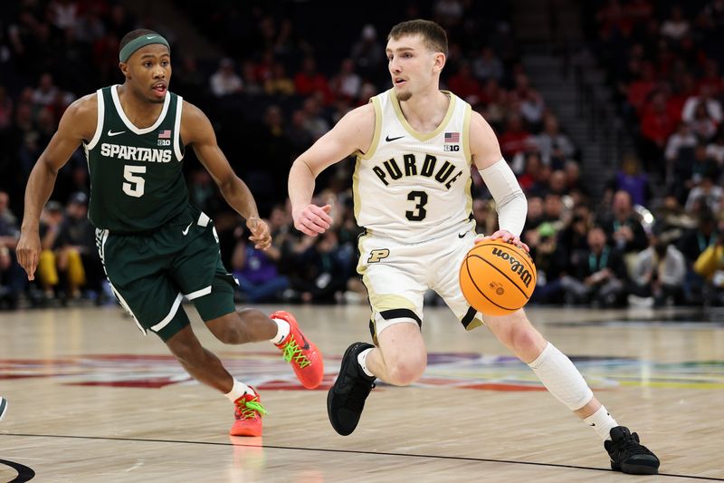 Mar 15, 2024; Minneapolis, MN, USA; Purdue Boilermakers guard Braden Smith (3) works around Michigan State Spartans guard Tre Holloman (5) during the first half at Target Center. Mandatory Credit: Matt Krohn-USA TODAY Sports